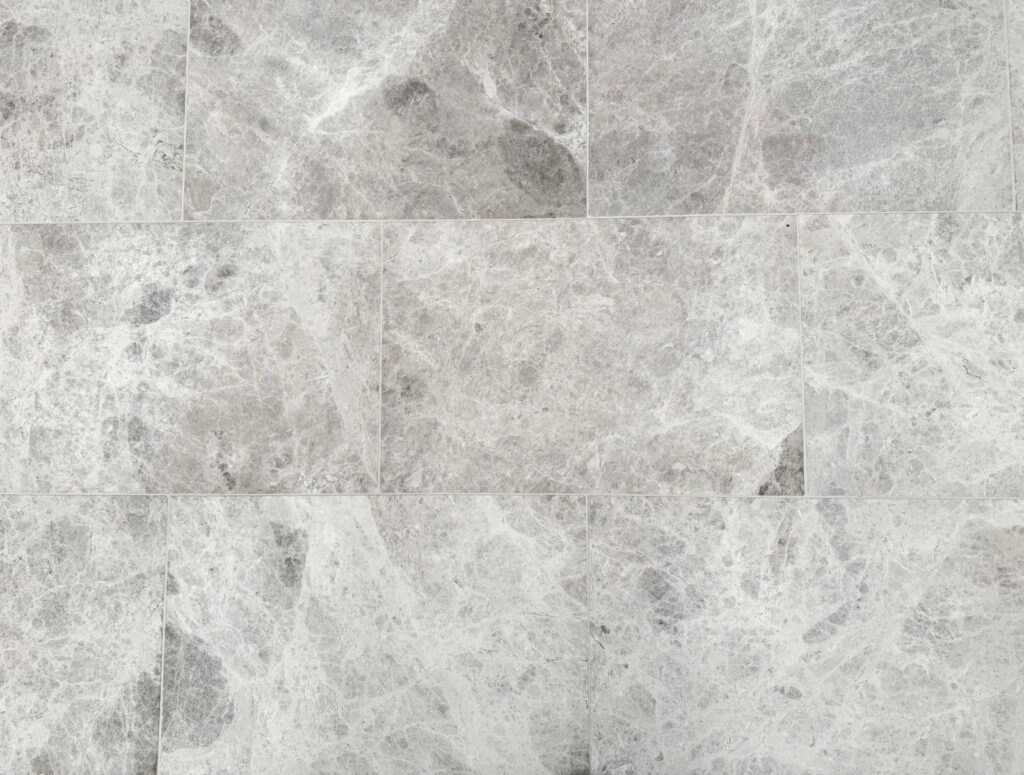 Luna Grey Marble tiles with soft white veining and a polished finish, ideal for elegant wall or floor applications.