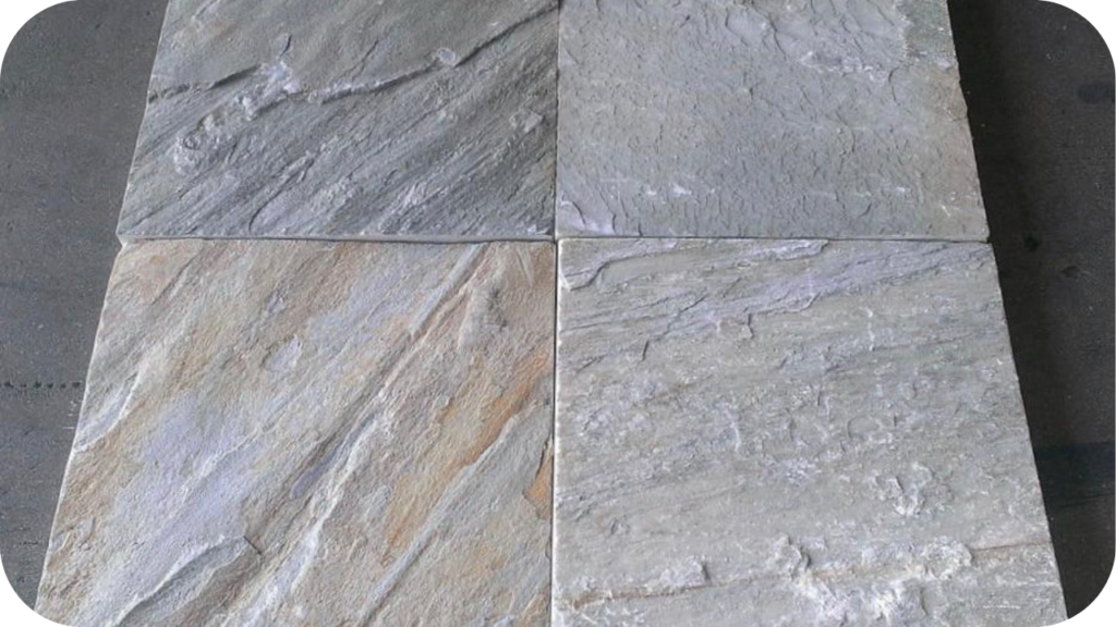 Close-up of natural quartzite pavers in soft grey and beige tones, highlighting the textured finish and durability ideal for outdoor paving projects.