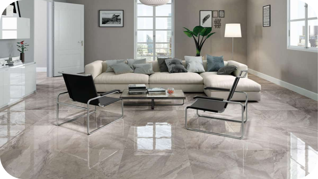 Modern living room with polished grey marble flooring, neutral décor, and minimalist furniture, showing popular marble types suited to Melbourne interiors.