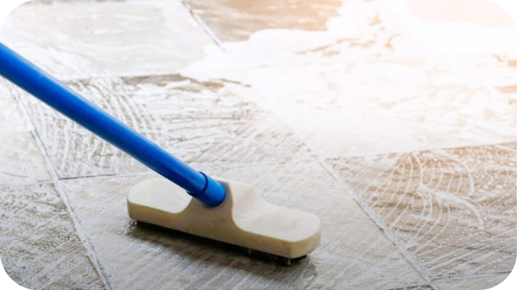 Travertine surface being gently cleaned with a mop, demonstrating essential care practices to maintain strength, beauty, and long-term performance.