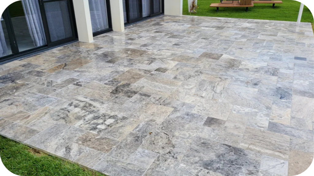 Silver travertine pavers laid on a patio, highlighting the natural veining and durability that define premium quality stone in Melbourne projects
