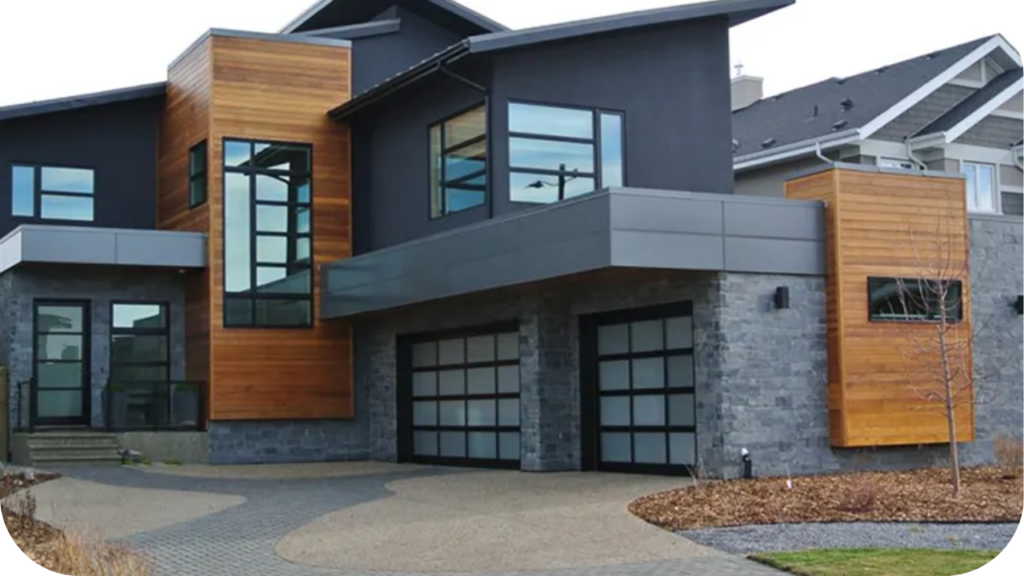 Modern home exterior with striking dark stone cladding and timber accents, reflecting architectural balance and refined stone integration.