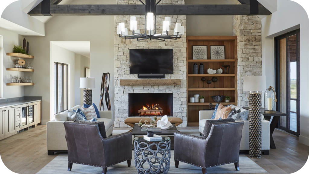 Modern living room with stone fireplace, leather chairs, and décor, showing how designers in Melbourne use natural stone for warmth and style.
