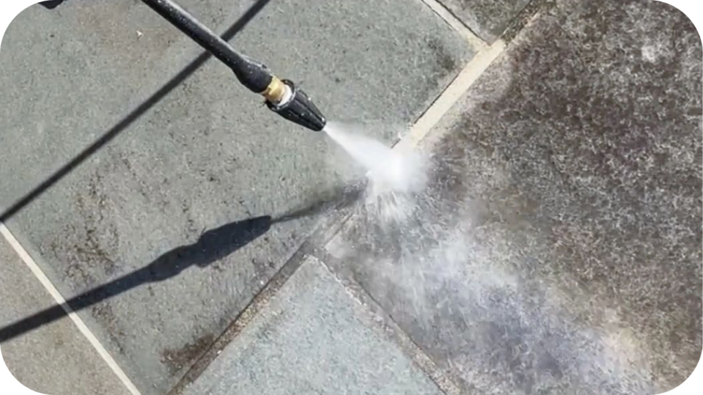 Pressure washing bluestone pavers to remove dirt and stains, showing how simple maintenance keeps bluestone surfaces clean, safe, and long-lasting outdoors.