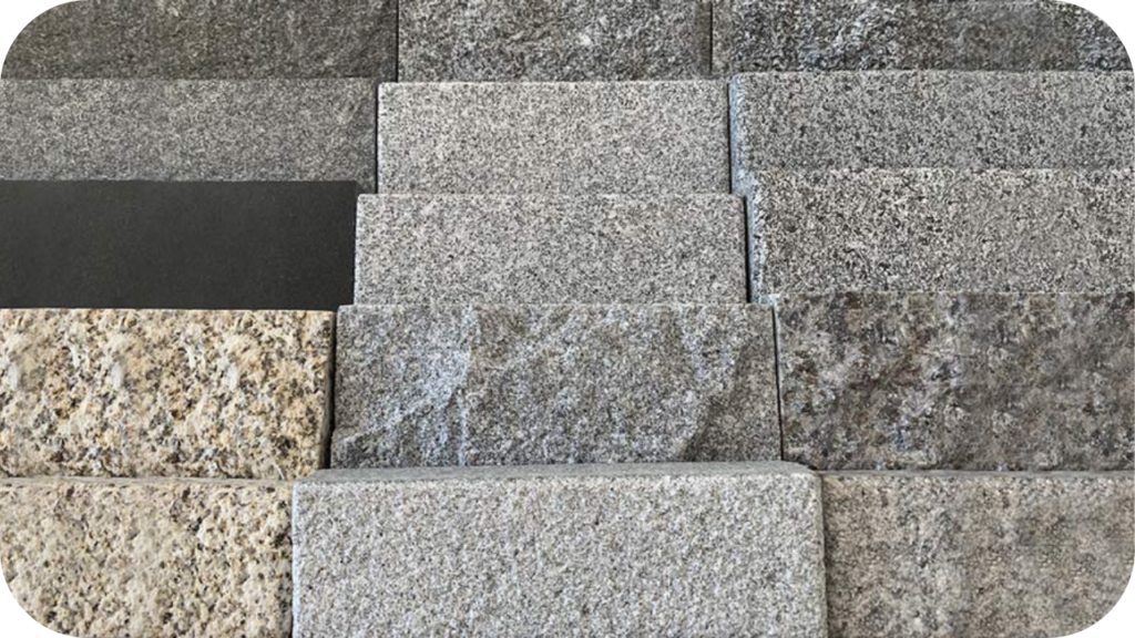 A selection of natural stone materials in varying textures and colours stacked together to show common stone types used in Australian landscapes.